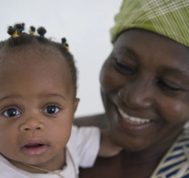 A person holds a baby.