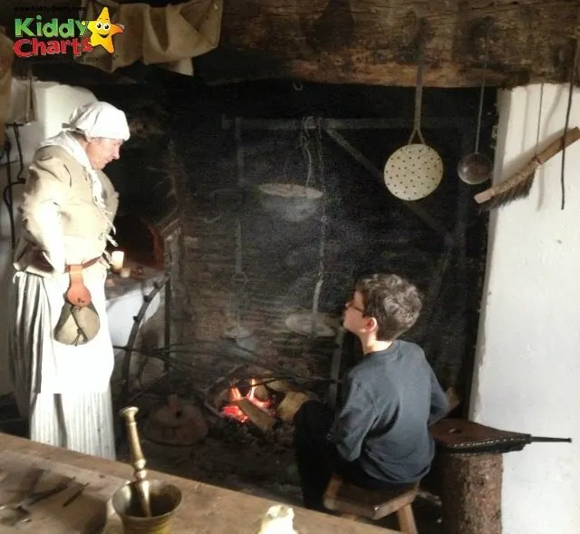Llancaiach Fawr gives the kids a chance to try what kids would have done in 1645 - here is Stuntboy as a spit boy!