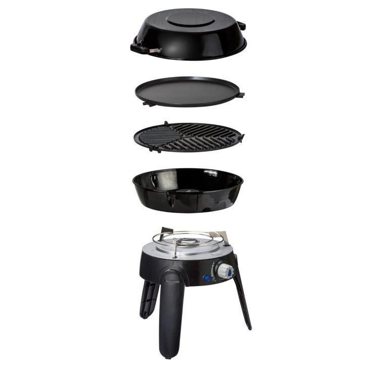 This image shows an exploded view of a cooking appliance, consisting of a lid, flat and ridged plates, a bowl, and a base with controls.