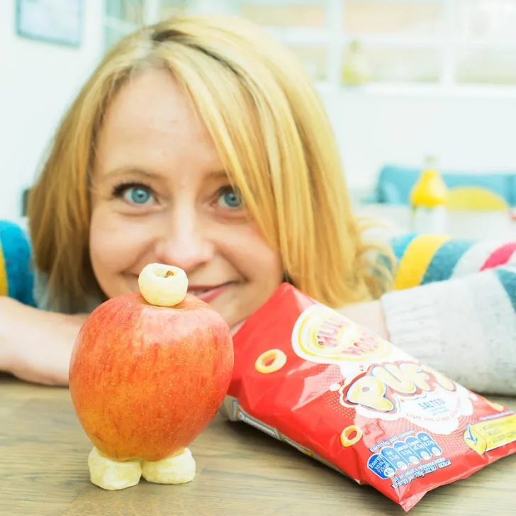 A person is eating an apple.