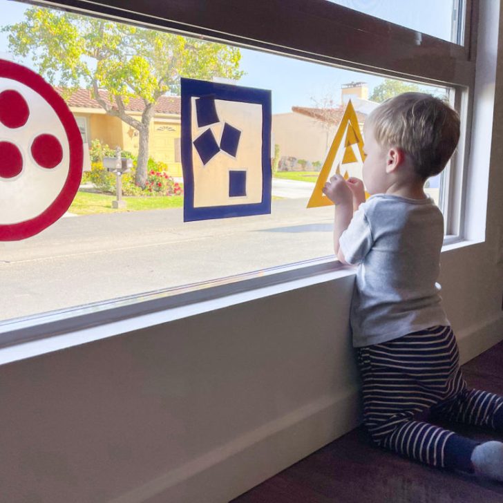 A cartoon child is happily playing indoors with the Hadicks Kiddye Chart.