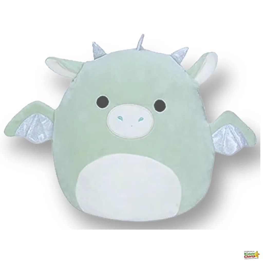 This image displays a soft, green dragon-themed plush toy with a cute facial expression, small wings, and horns, presented against a white background.