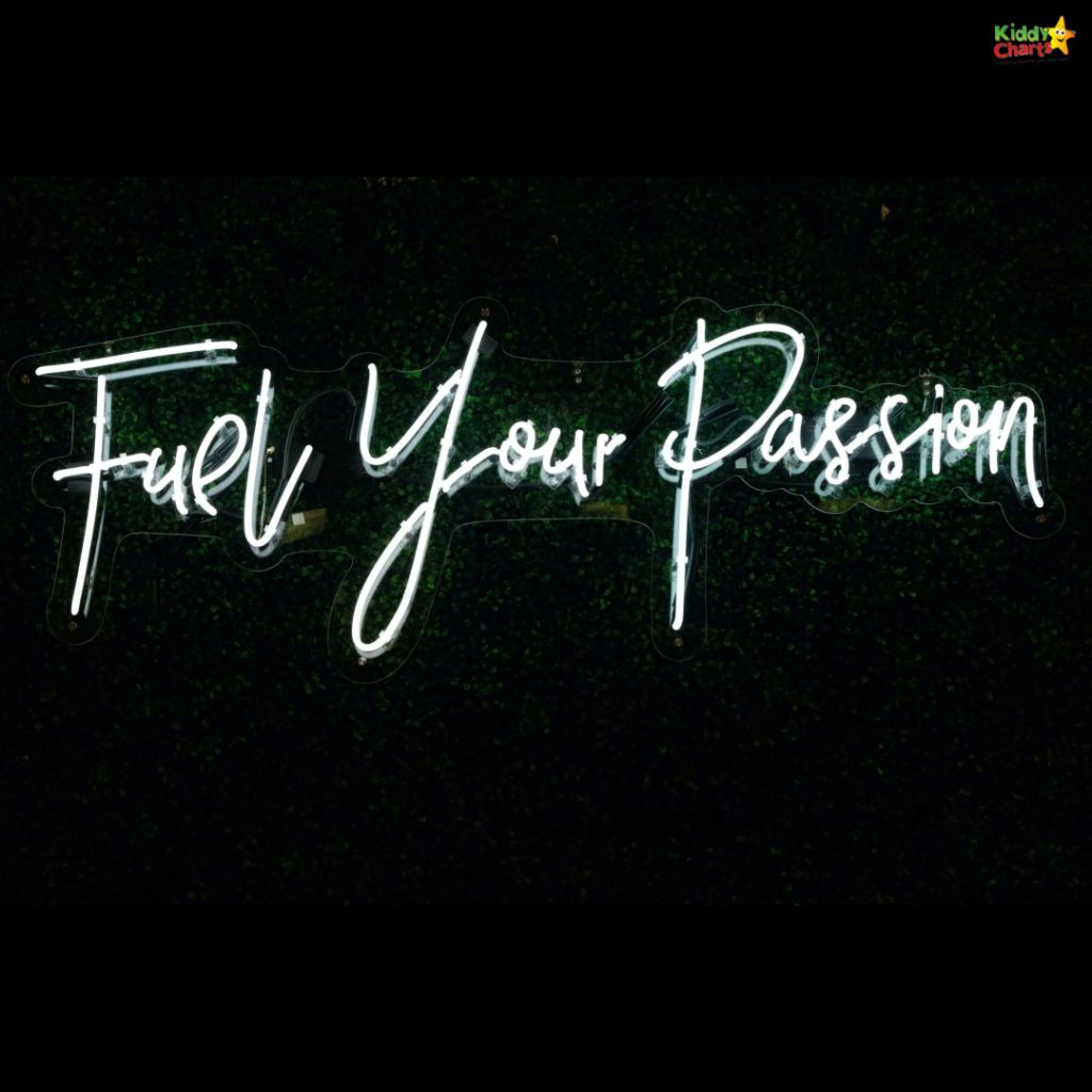 The image showcases white neon sign letters against a dark green background, spelling out the inspirational phrase "Fuel Your Passion."